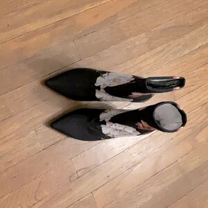 These Ted baker heels/boots are size six with a flower pattern on a black back